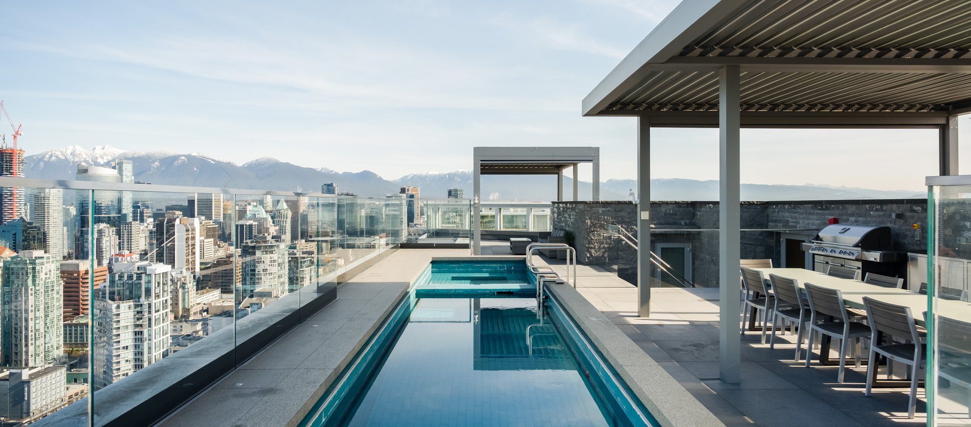 outdoor pool and bbq station on the rooftop at the penthouse level vancouver richards