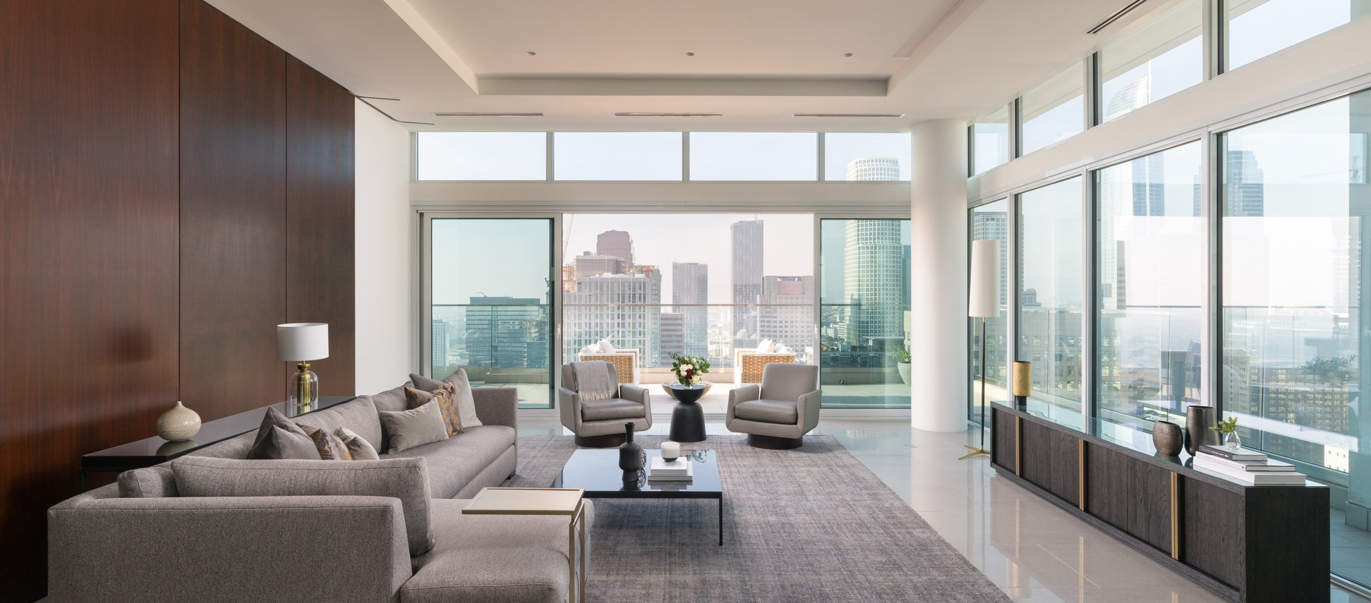 level south olive penthouse featuring spacious living room, open concept and dtla city view from balcony