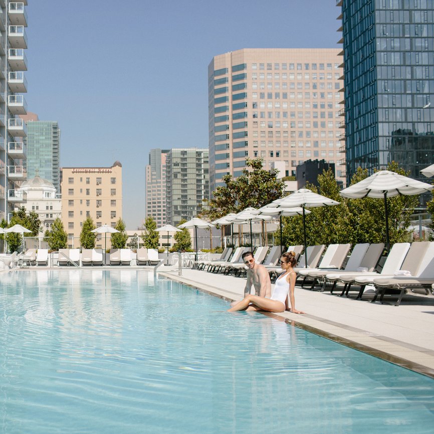 couple enjoying the pool at level los angeles downtown south olive