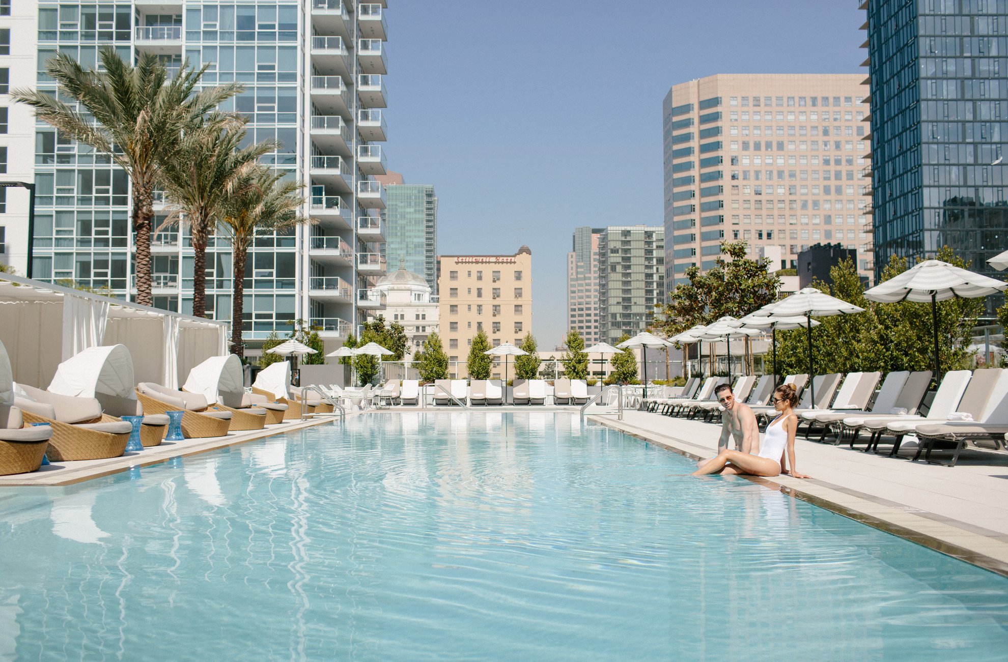 couple enjoying the pool at level los angeles downtown south olive