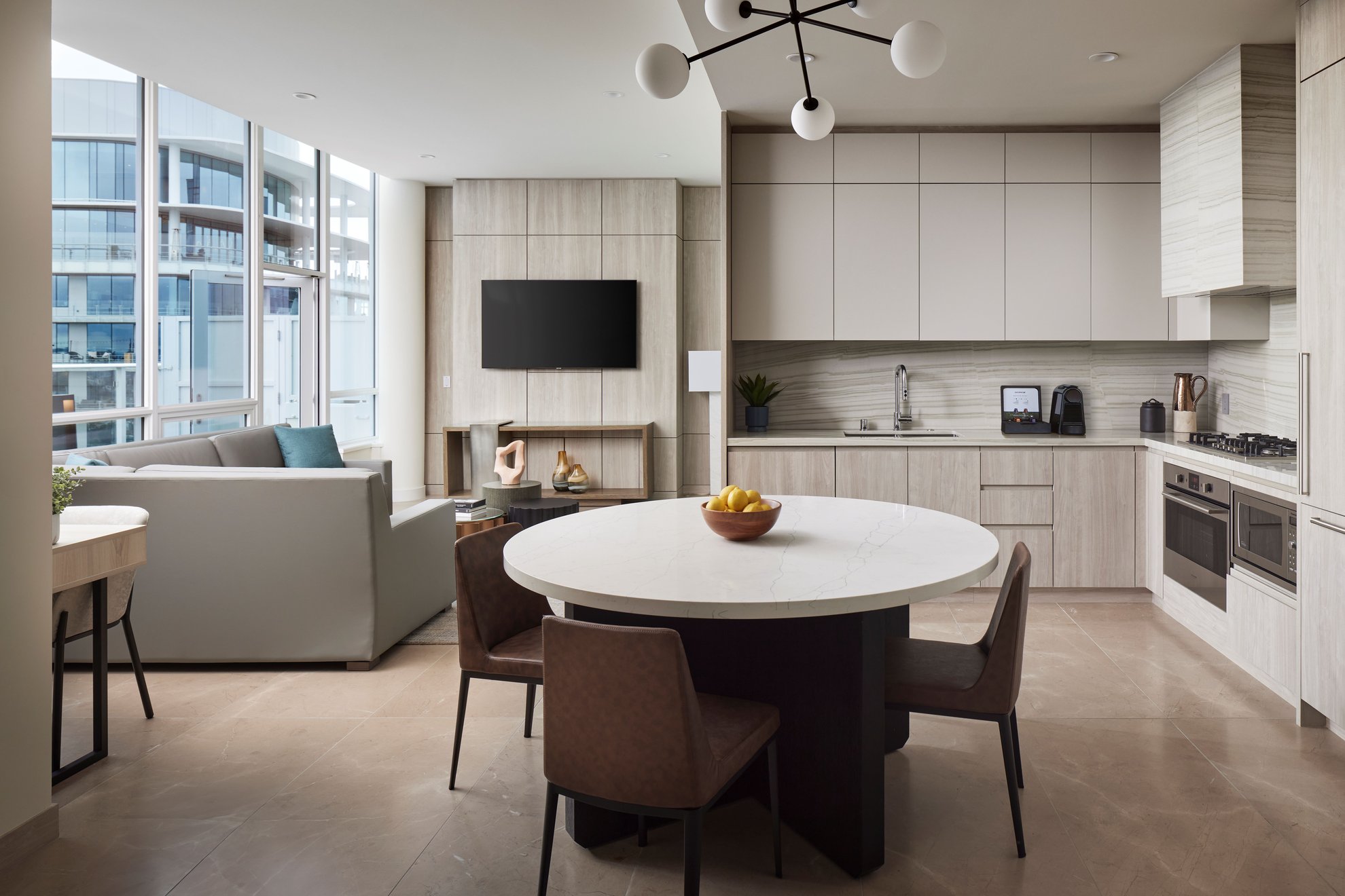 contemporary penthouse living area and kitchen with sleek design and ample seating at Level Seattle south lake union.jpg