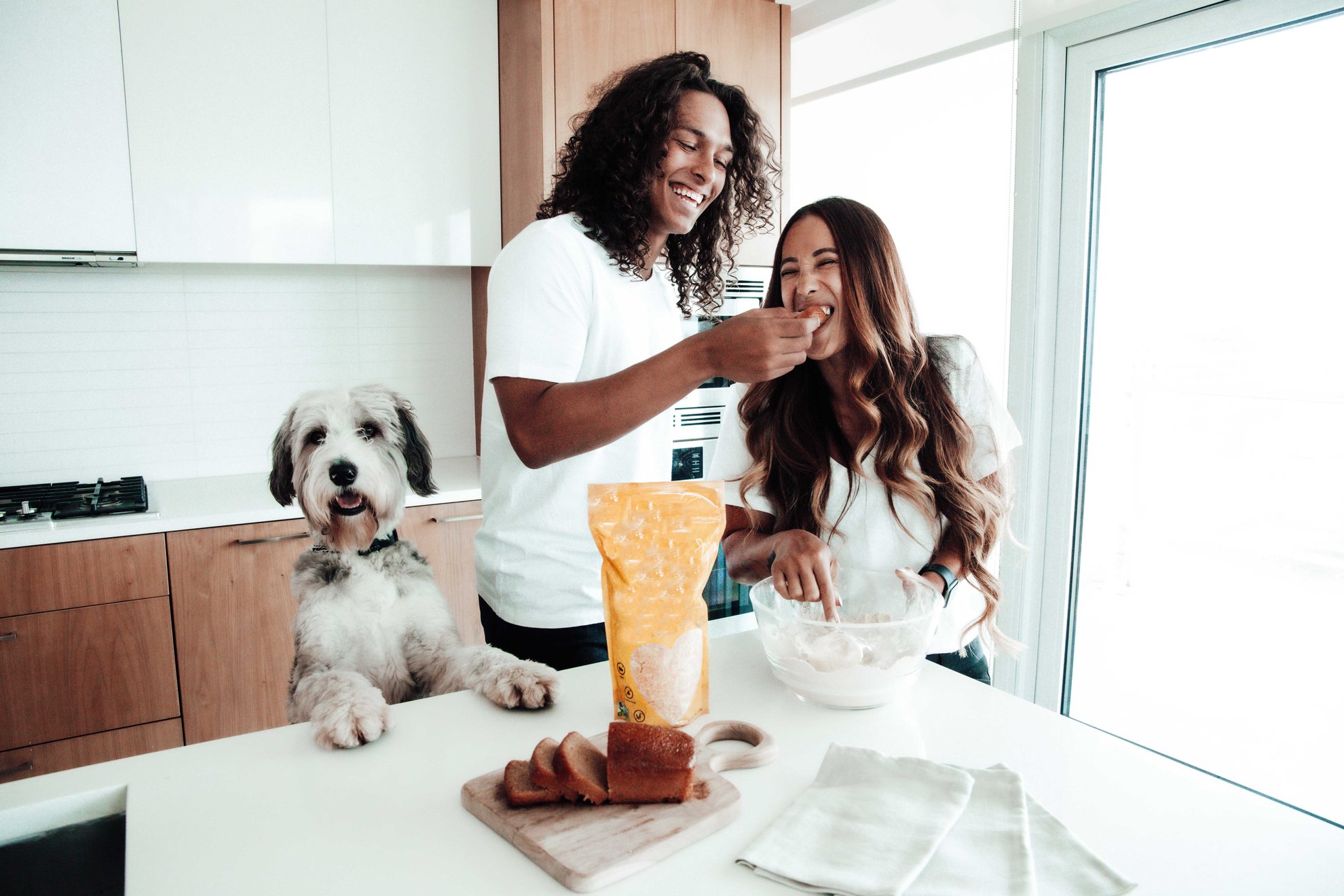 Couple laughing in the kitchen