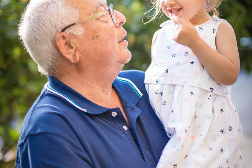 Grandpa holding child