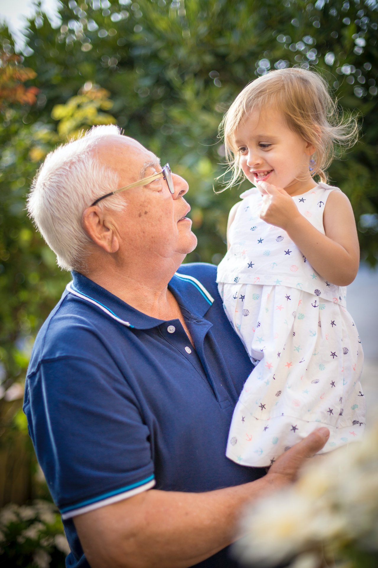 Grandpa holding child