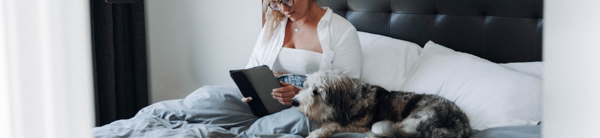 Relaxing in Bed with Dog