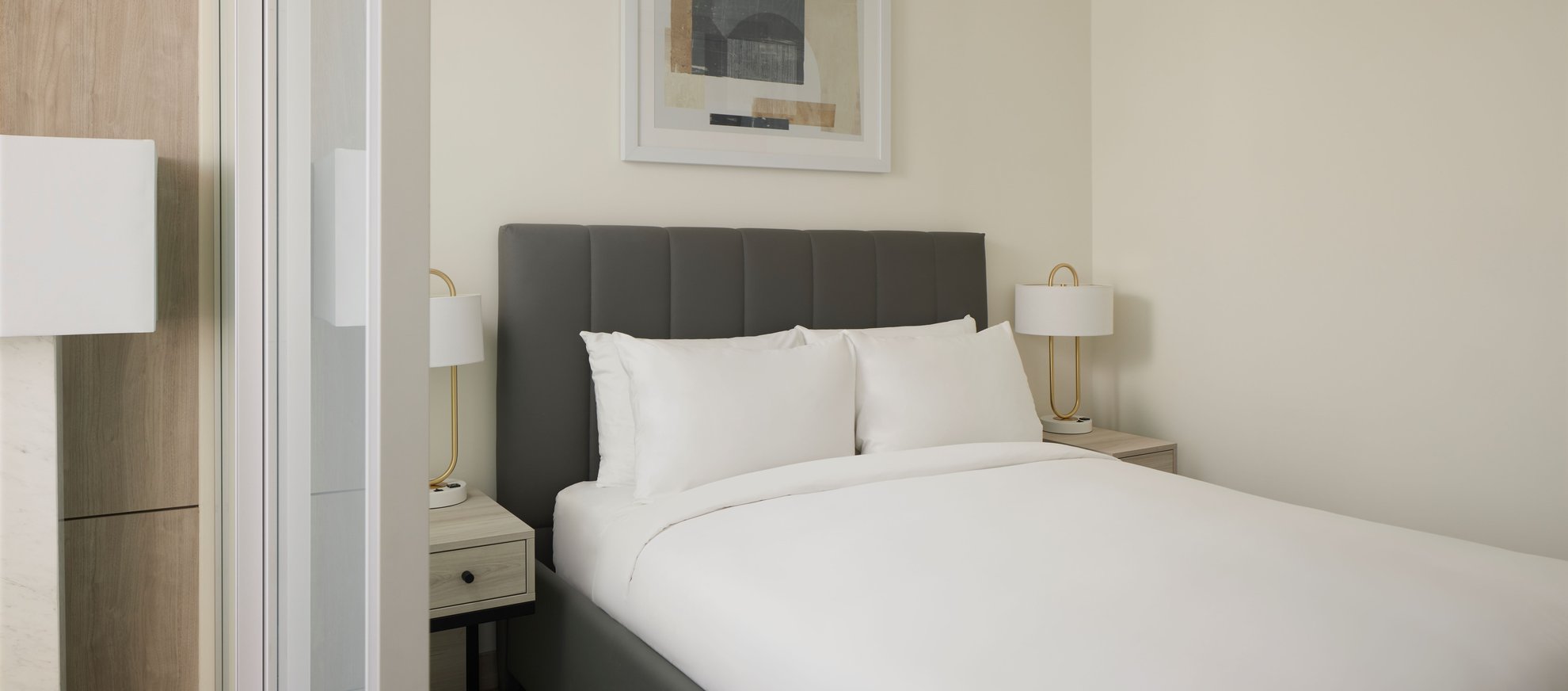 modern bedroom with nightstand each side of the bed at level seattle south lake union the penthouse.jpg