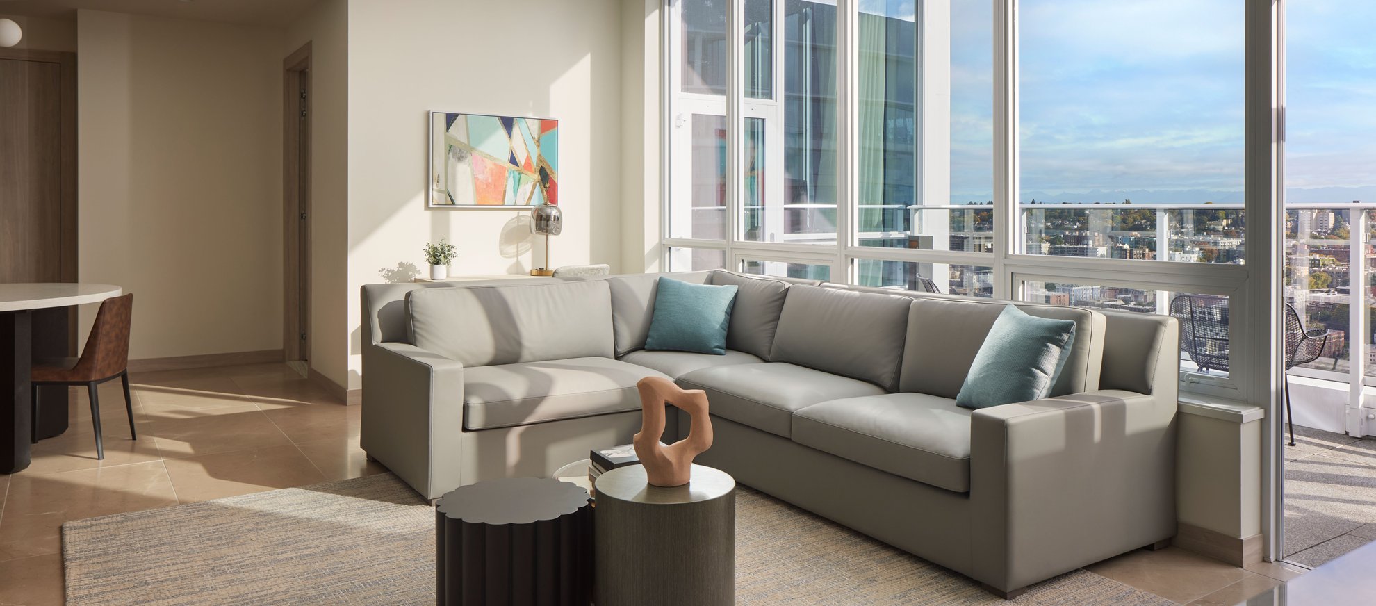 spacious living area suite at the penthouse level seattle south lake union with high ceilings window and natural light.jpg